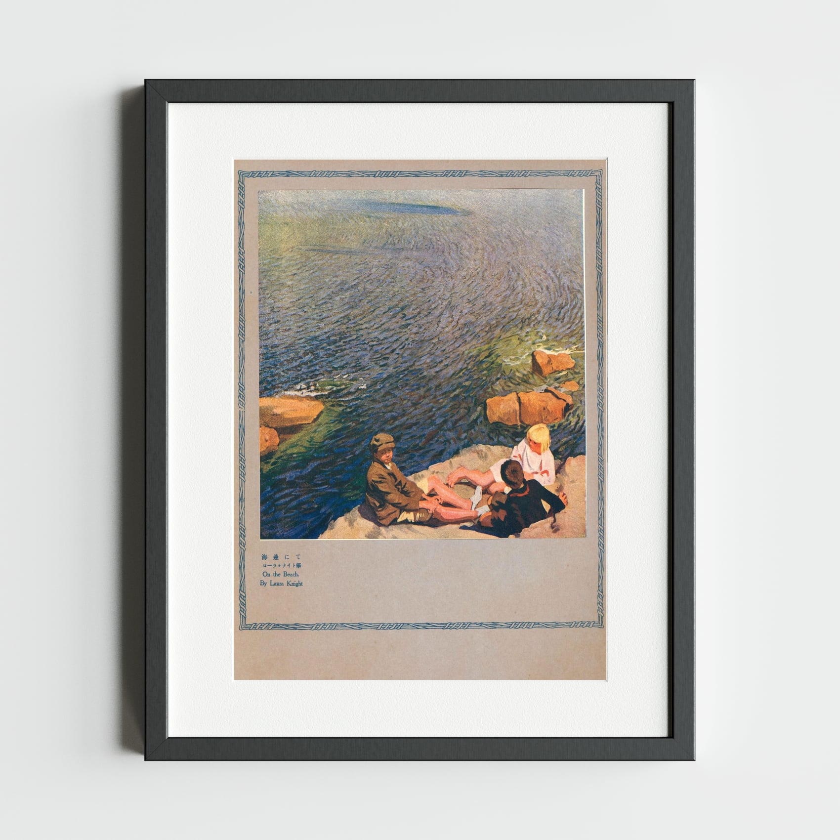 ‘On the Beach’ by Dame Laura Knight — three figures resting on sunlit orange rocks beside a shimmering blue-green sea; a British Impressionist coastal scene reproduced in the Japanese magazine International Graphics, July 1923.